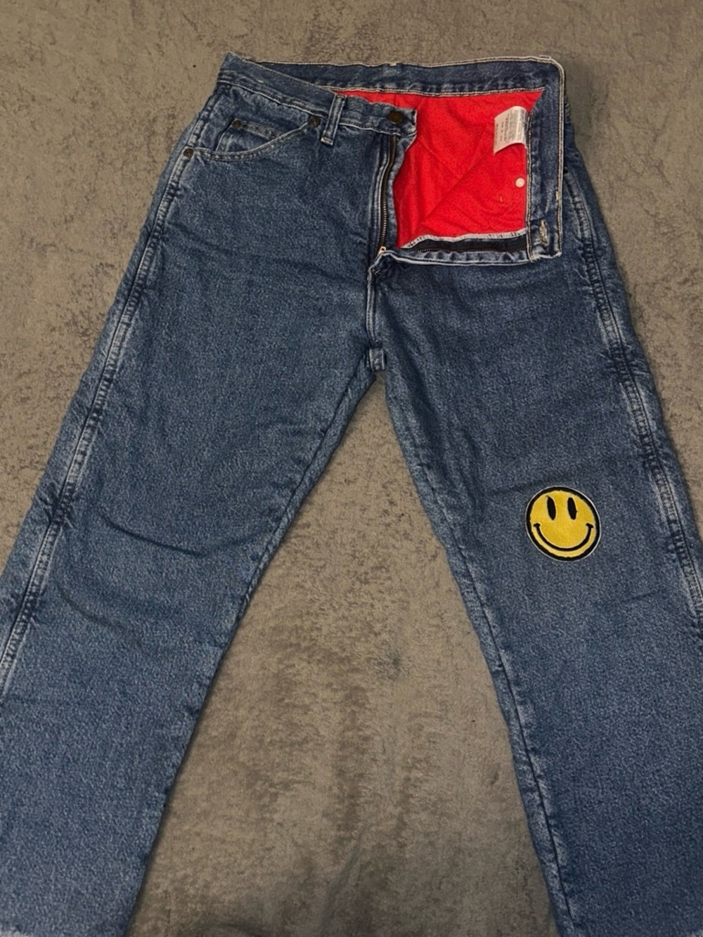 Wrangler Blue Straight Jeans with Yellow Smiley Patch and Red Pocket Lining